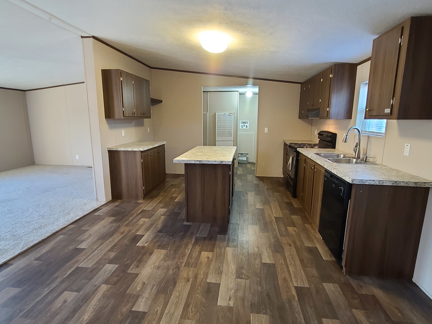 303 Seba Street Hurst, IL 62949 - Photo 5 of 13 a kitchen with a sink appliances and cabinets