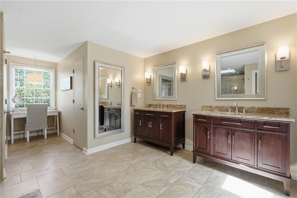900 Settlers Ridge Road Pittsburgh, PA 15238 - Photo 26 of 50 Spacious and spa-inspired, the luxurious ensuite bath features separate vanities, additional storage rooms, a dedicated makeup station.