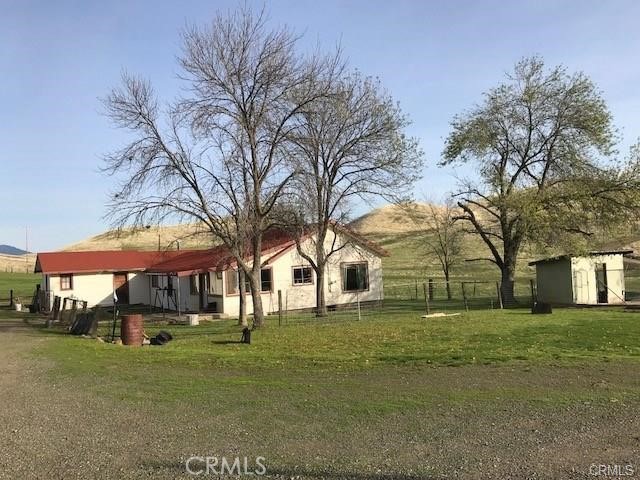 0 Mcauliffe Road Cottonwood, CA 96022 - Photo 6 of 59 a view of a yard with a table and chairs under an umbrella