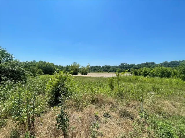 a view of lake with green space