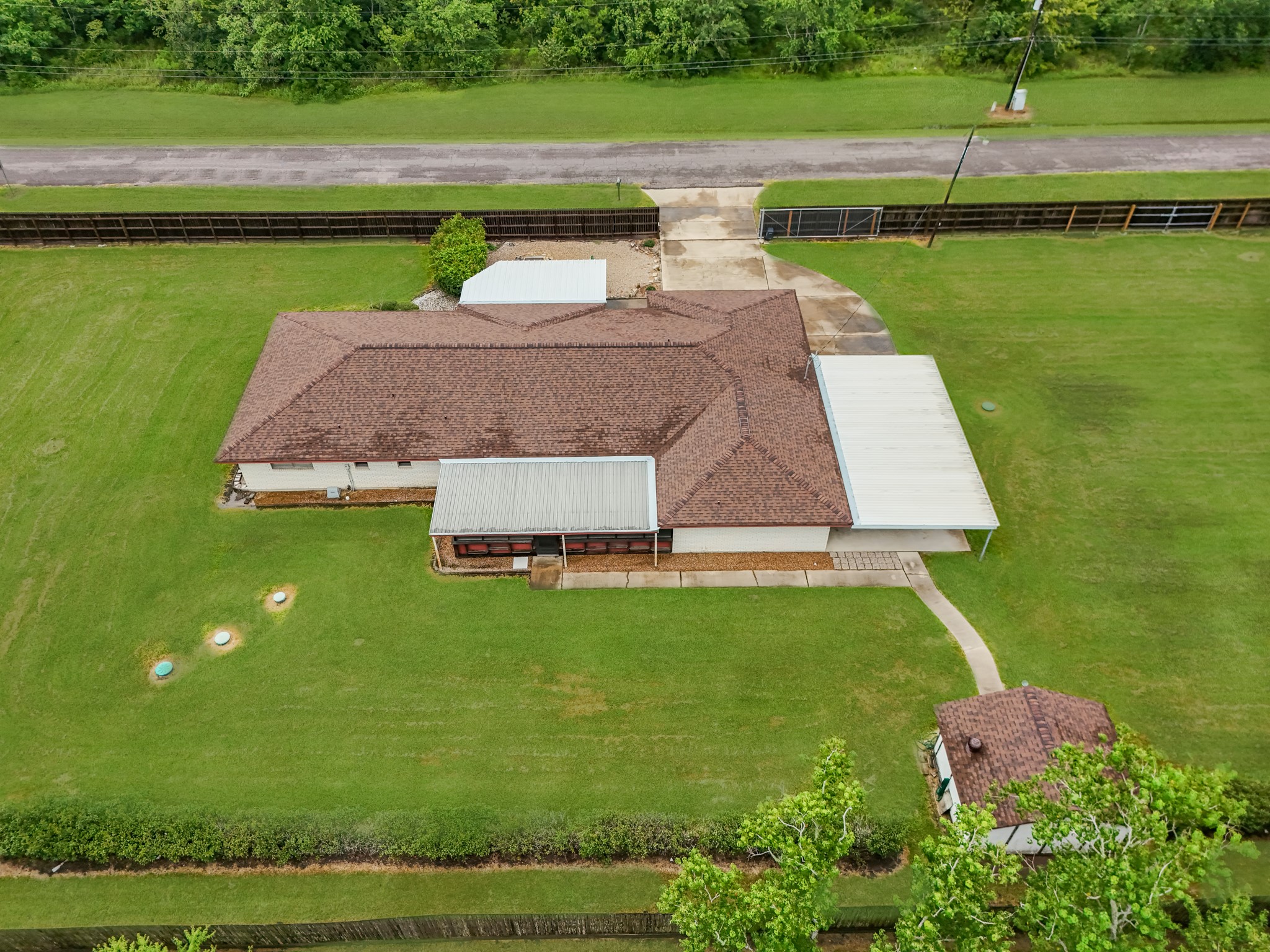 7315 Pine Street Manvel, TX 77578 - Photo 11 of 50 a aerial view of a house with a garden and lake view