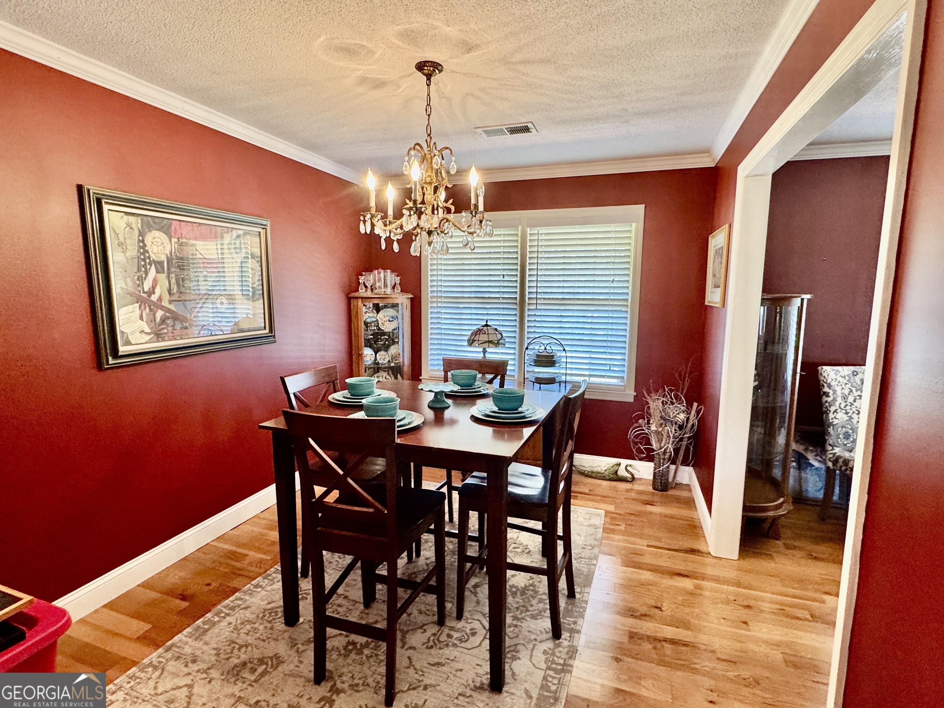 1530 Lankford Road Bowersville, GA 30516 - Photo 4 of 14 a view of a dining room with furniture and wooden floor