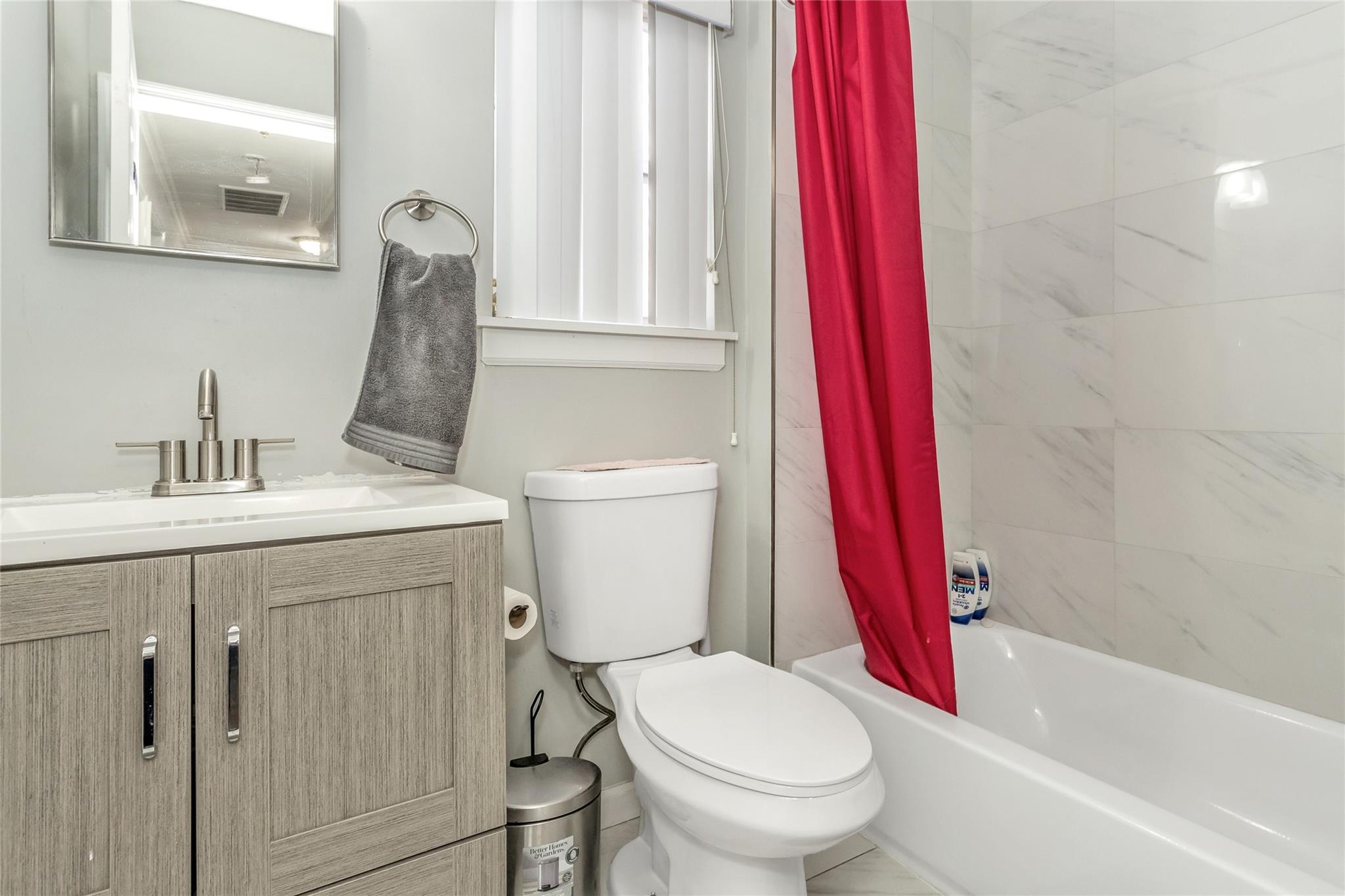 9 Bayberry Road Wading River, NY 11792 - Photo 12 of 17 Full bathroom featuring toilet, vanity, and shower / tub combo with curtain