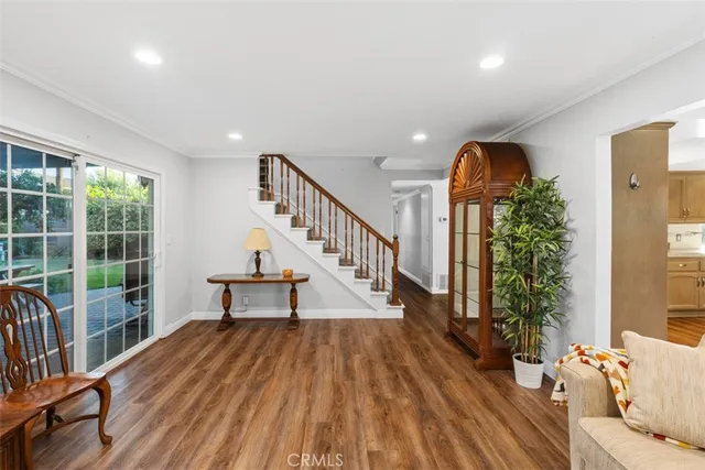 a view of entryway with wooden floor and a potted plant