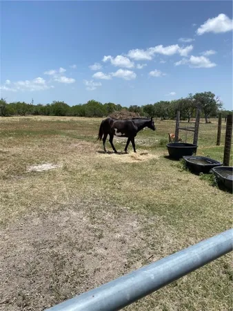 a view of a lake with a house in the background