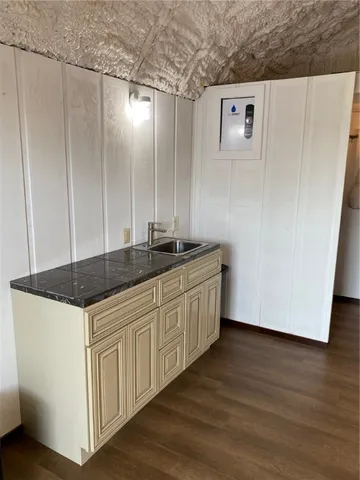 a kitchen with a sink and cabinets