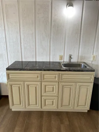 a view of a kitchen with granite countertop