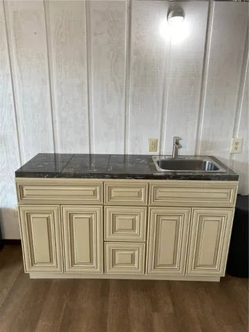 a view of a kitchen with granite countertop