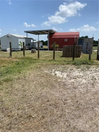 a view of a park with swings and slides