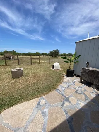 a view of a lake with a yard