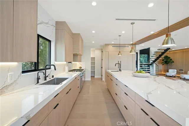 a view of a house with pool and sitting area