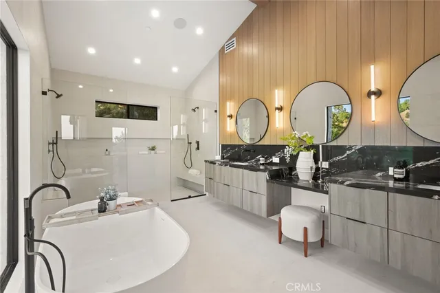 a bedroom with a bed a mirror and a window