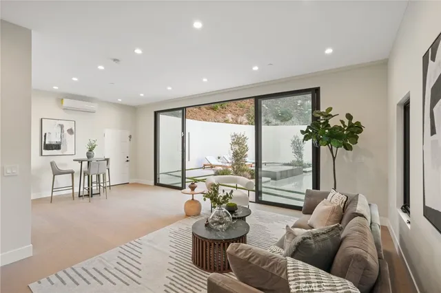 a bed room with a bed and large glass window