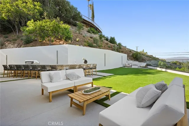 a large room with a large window and cabinets