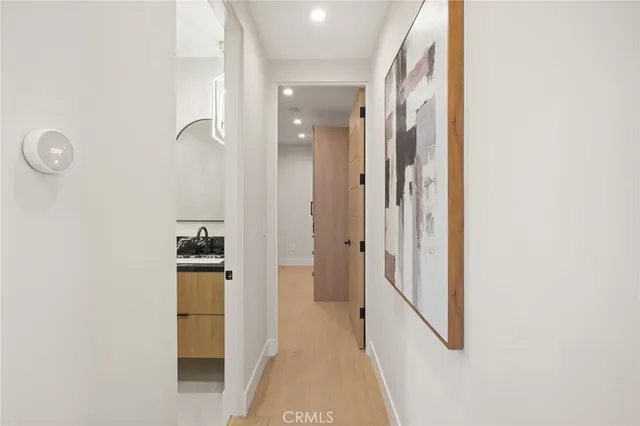 a view of a hallway with washer and dryer