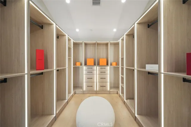 a living room with furniture and a painting on the wall