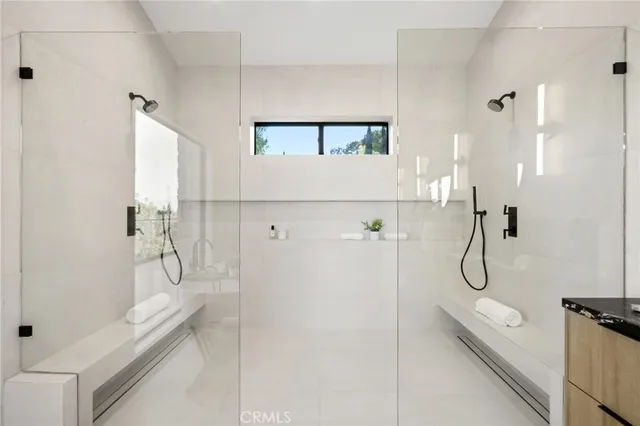 a kitchen with a sink a stove and cabinets
