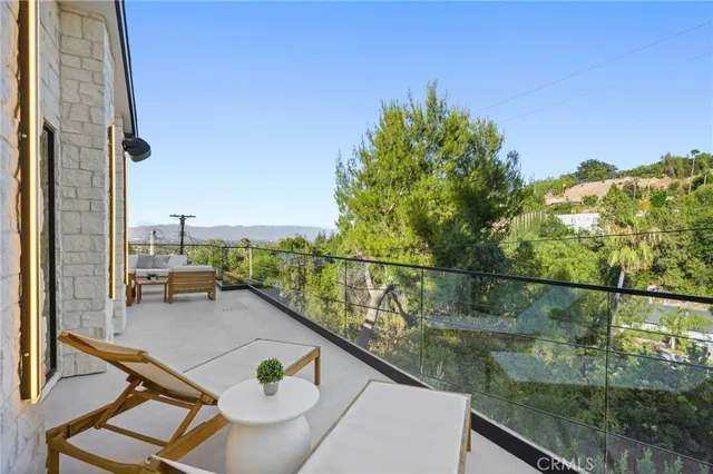 a living room with stainless steel appliances kitchen island granite countertop furniture and a kitchen view