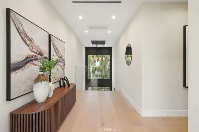 a view of a patio with table and chairs with wooden floor and fence