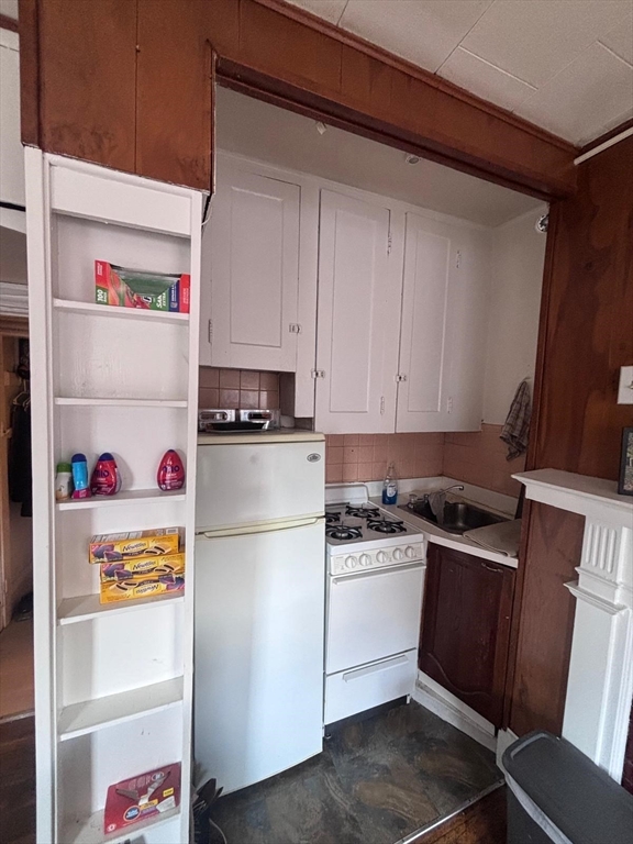 85 Phillips Street, Unit 7 Boston, MA 02114 - Photo 3 of 5 a white refrigerator freezer sitting inside of a kitchen