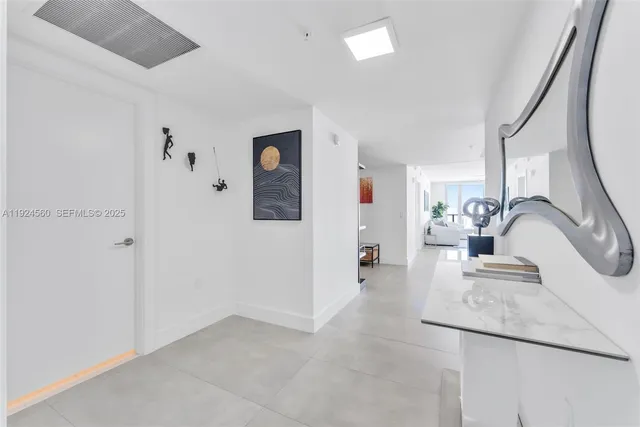 a view of a kitchen with a sink dishwasher and a refrigerator