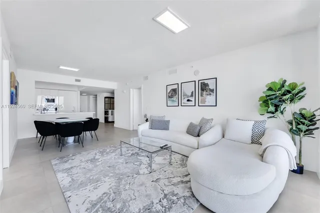 a living room with furniture and a table