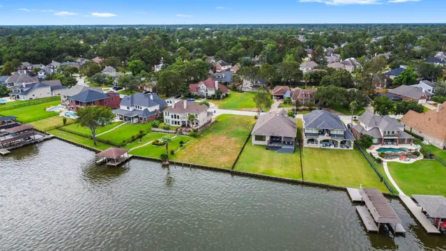 an aerial view of a house with a swimming pool