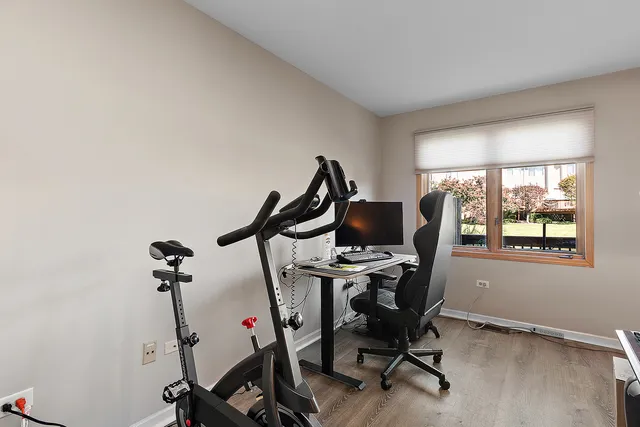 a view of a workspace with furniture and windows
