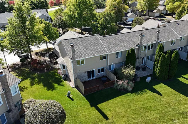 a view of a backyard with swimming pool