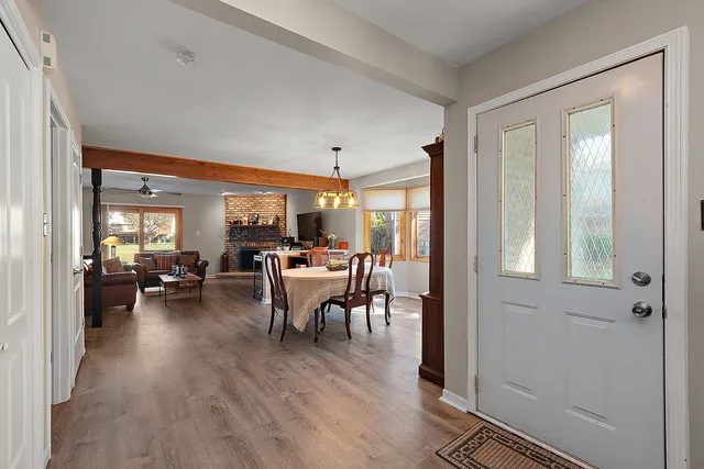 a view of a dining room with furniture window and wooden floor