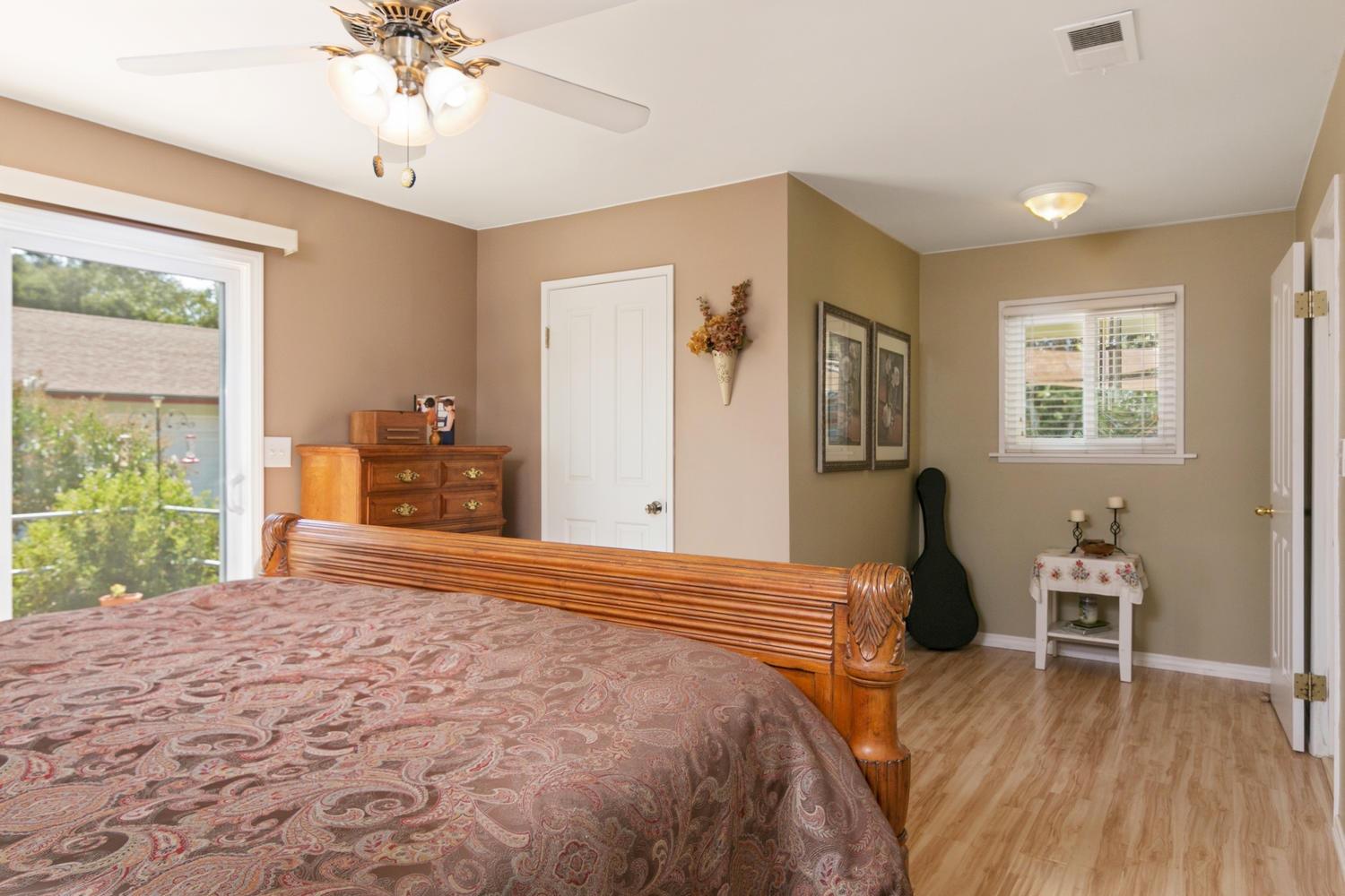 750 South Rice Road Ojai, CA 93023 - Photo 12 of 27 a bedroom with a bed and a chandelier