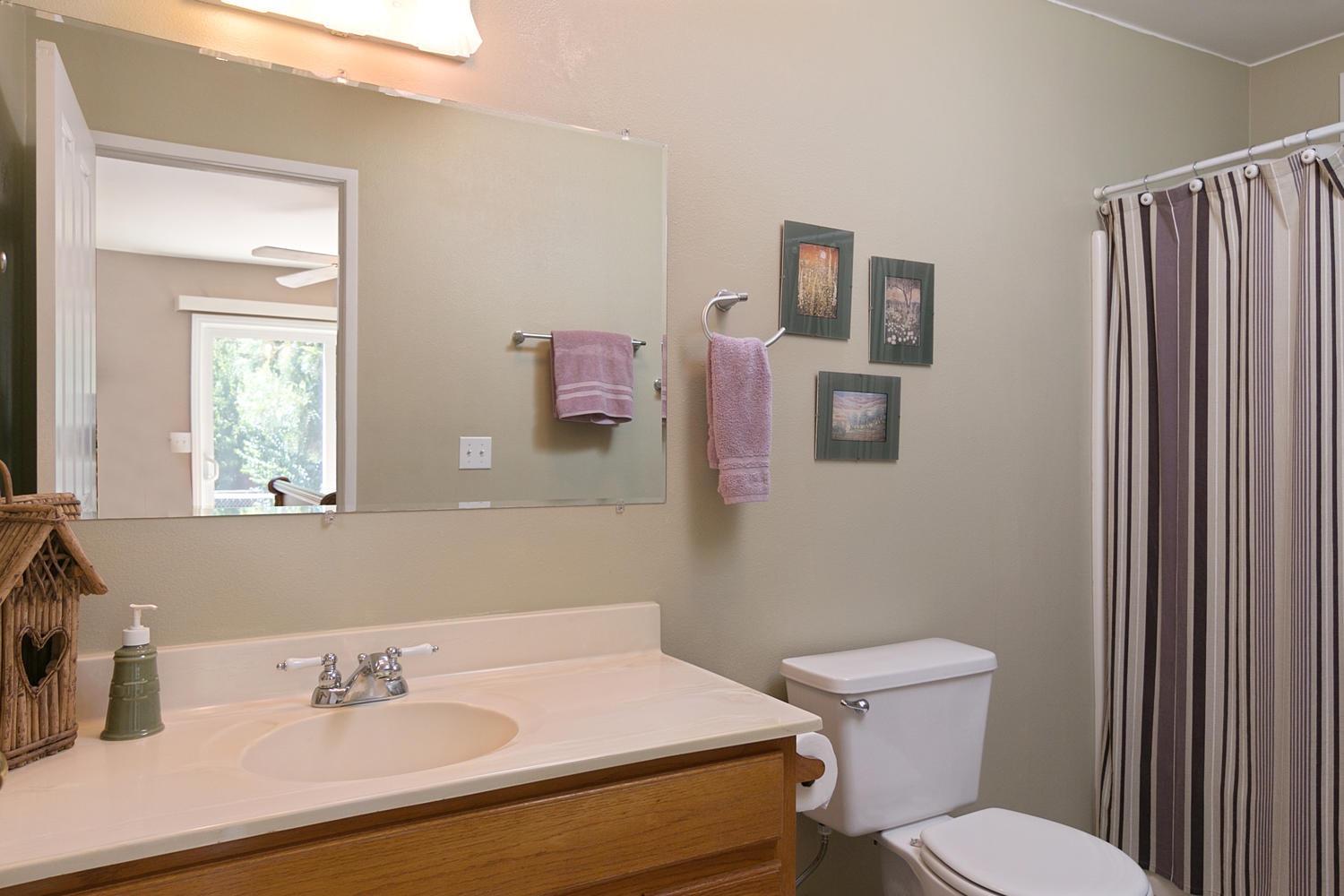 750 South Rice Road Ojai, CA 93023 - Photo 13 of 27 a bathroom with a sink toilet and mirror