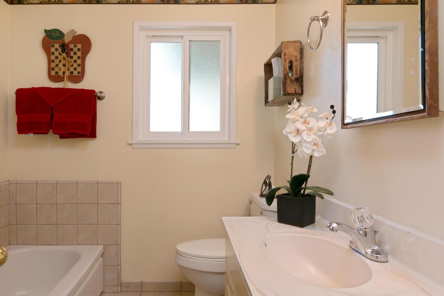 750 South Rice Road Ojai, CA 93023 - Photo 18 of 27 a bathroom with a sink a toilet and mirror