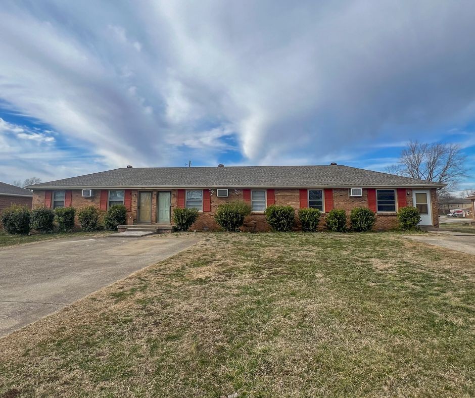 135 Airport Road, Unit C Clarksville, TN 37042 - Photo 1 of 16 a front view of a building with a garden