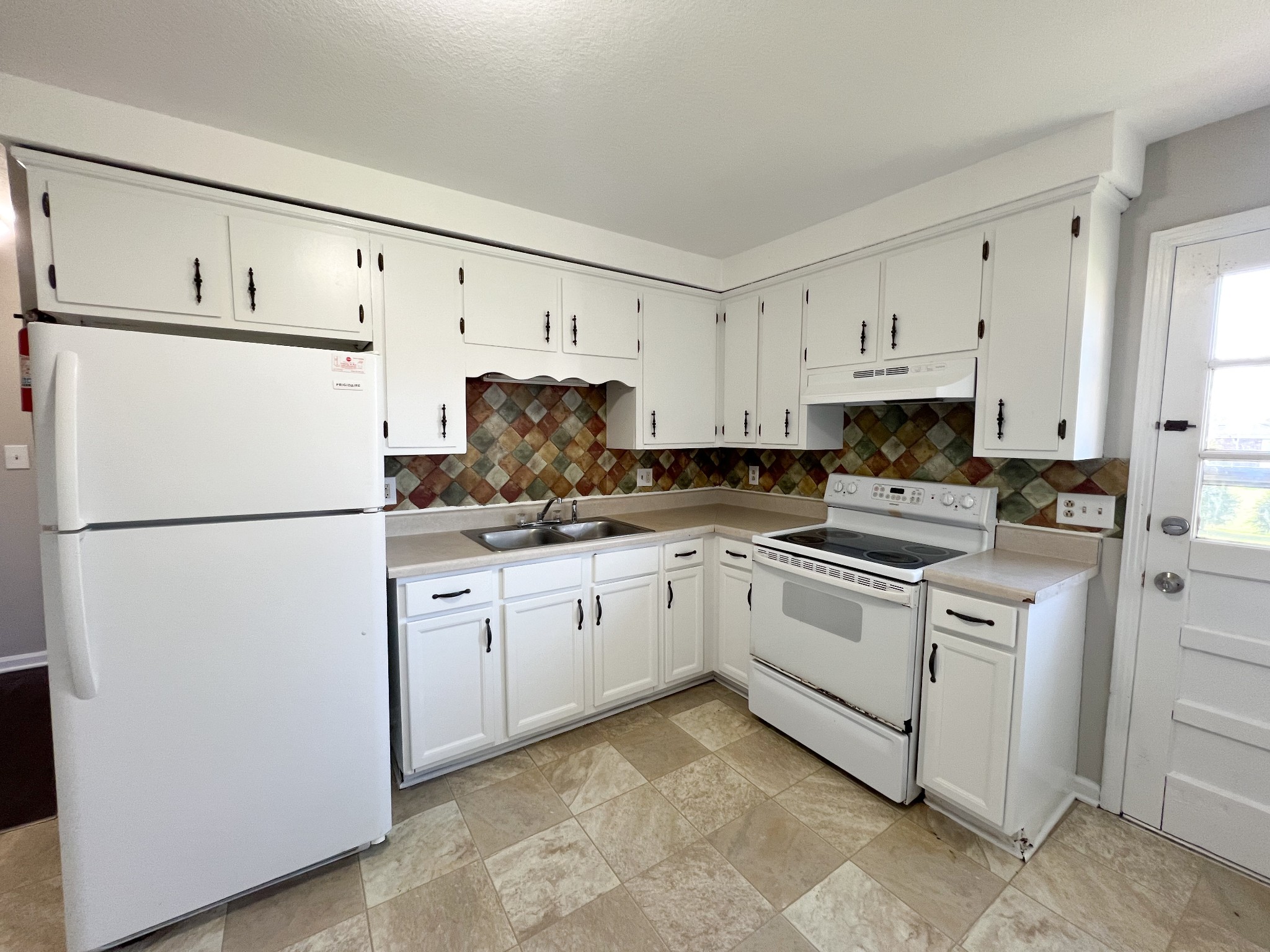 135 Airport Road, Unit C Clarksville, TN 37042 - Photo 7 of 16 a kitchen with cabinets stainless steel appliances and a counter space