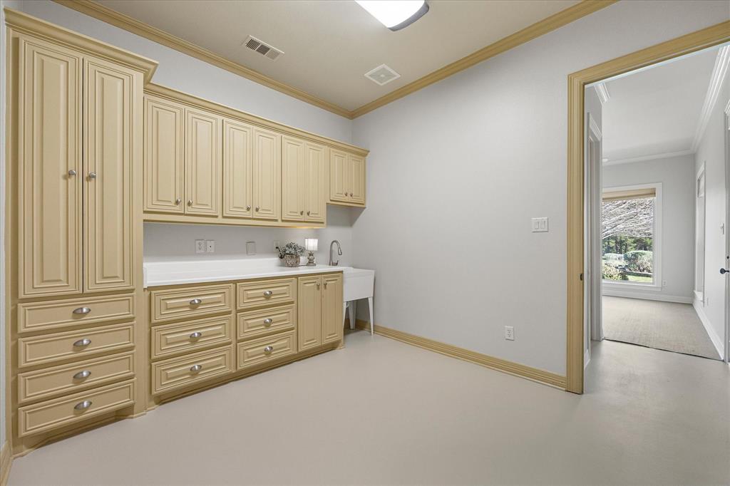 161 Ridgemont Road Heath, TX 75126 - Photo 17 of 40 a room with cabinets and window