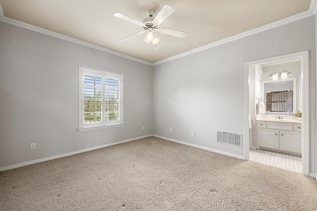 161 Ridgemont Road Heath, TX 75126 - Photo 26 of 40 an empty room with a window and a ceiling fan
