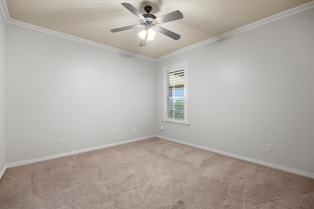 161 Ridgemont Road Heath, TX 75126 - Photo 32 of 40 an empty room with windows and fan