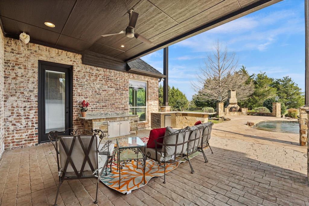 161 Ridgemont Road Heath, TX 75126 - Photo 34 of 40 a view of a patio with table and chairs and potted plants