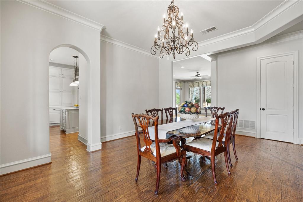 161 Ridgemont Road Heath, TX 75126 - Photo 6 of 40 a view of a dining room with furniture wooden floor and chandelier