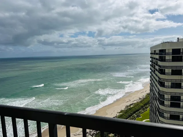 a view of a lake from a balcony