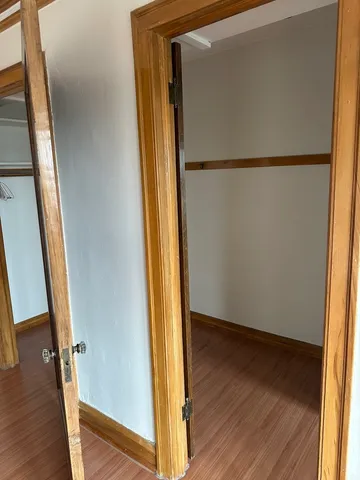 a view of front door with wooden floor