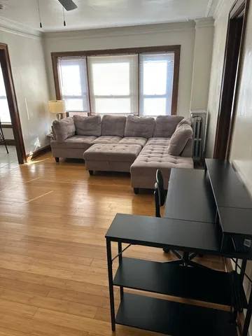 a kitchen with a stove top oven and cabinets