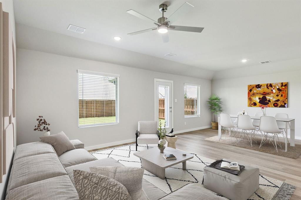 1104 Sunward Road Princeton, TX 75407 - Photo 9 of 27 Living Room in the Harper home plan by Trophy Signature Homes – REPRESENTATIVE PHOTO
