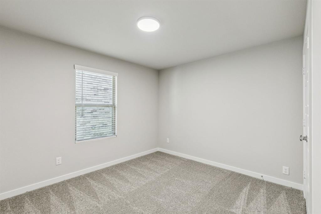 1104 Sunward Road Princeton, TX 75407 - Photo 21 of 27 Bedroom in the Harper home plan by Trophy Signature Homes – REPRESENTATIVE PHOTO