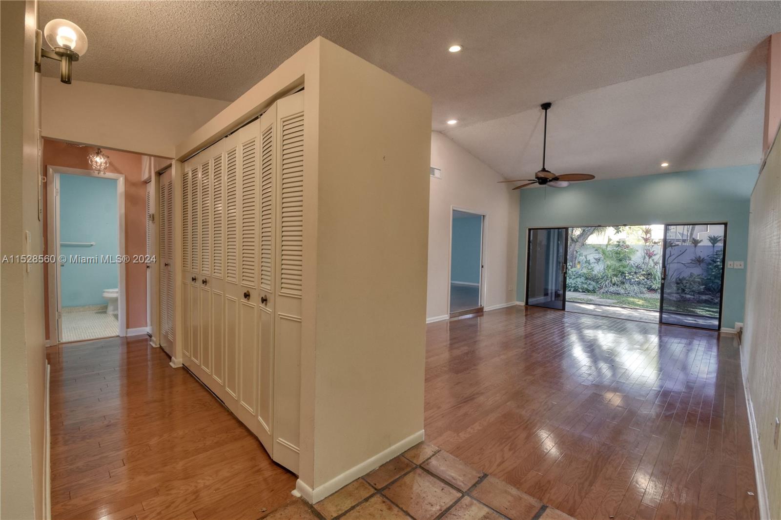 Kendall Miami, FL 33173 - Photo 4 of 8 a view of a hallway with wooden floor and chandelier