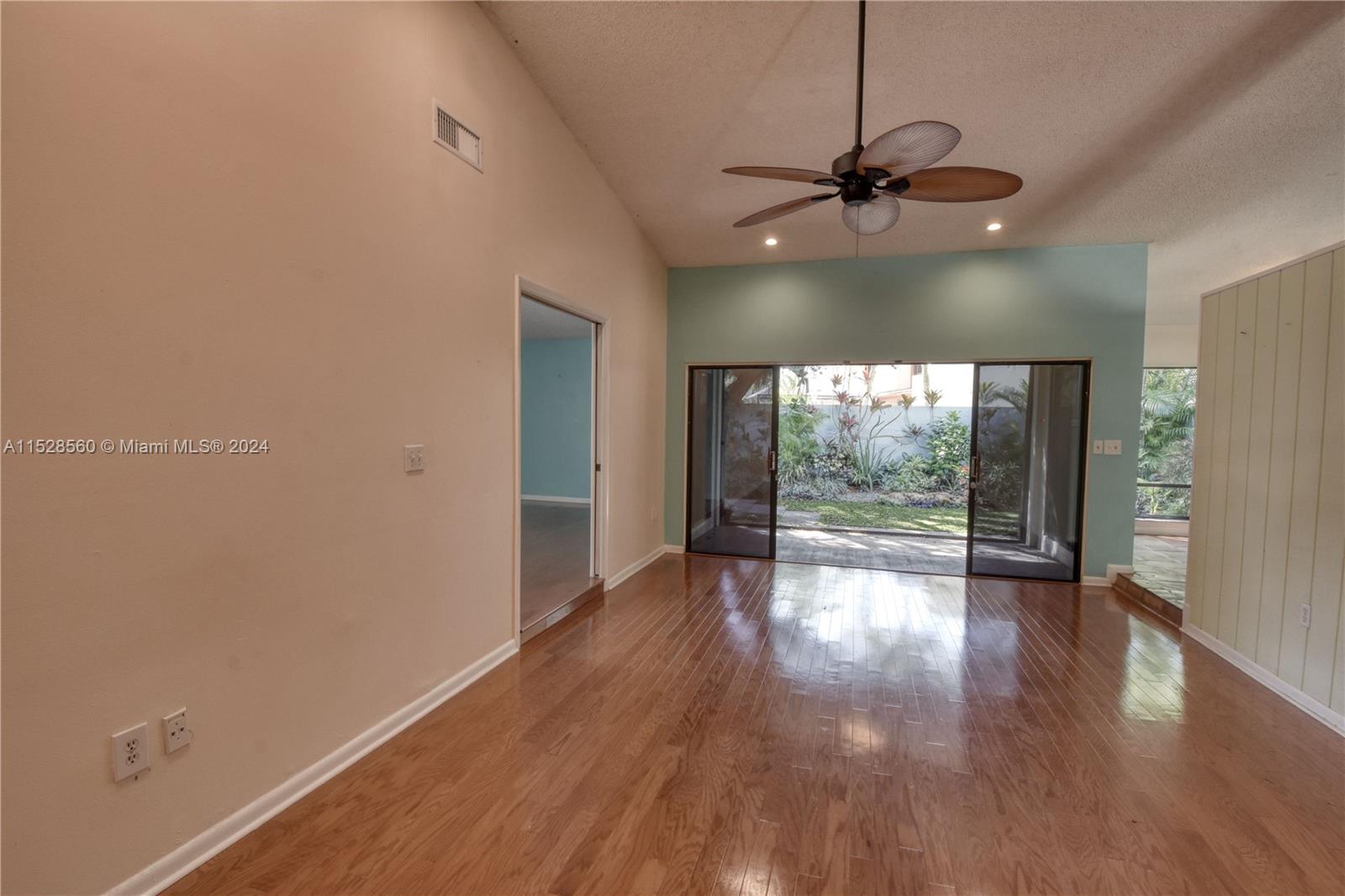 Kendall Miami, FL 33173 - Photo 7 of 8 a view of an empty room with wooden floor and a window