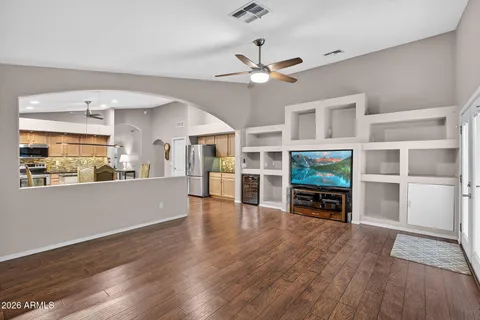 a kitchen with stainless steel appliances granite countertop refrigerator sink and microwave