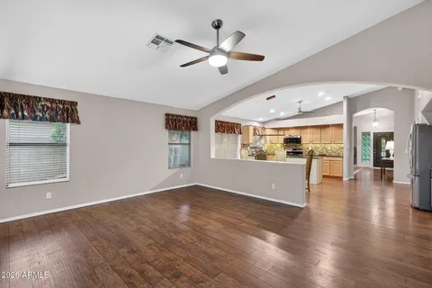 a kitchen with stainless steel appliances granite countertop a stove refrigerator sink and cabinets