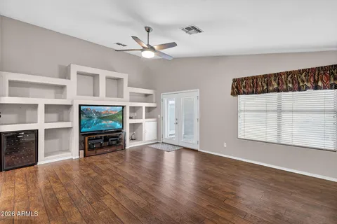 a view of a dining room with furniture and wooden floor